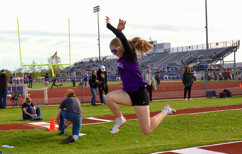 Rochelle's Jamie Riddell soars in her triple jump attempt during a meet held on April 28 in Rochelle. Riddell won the event.