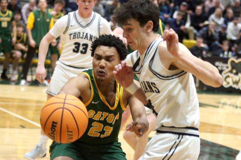 Crystal Lake South’s David McFadden, left, battles Cary-Grove’s Dylan Dumele for the ball in boys IHSA Class 3A Regional Championship basketball on Friday, Feb. 27, 2026, at Crystal Lake South High School in Crystal Lake.