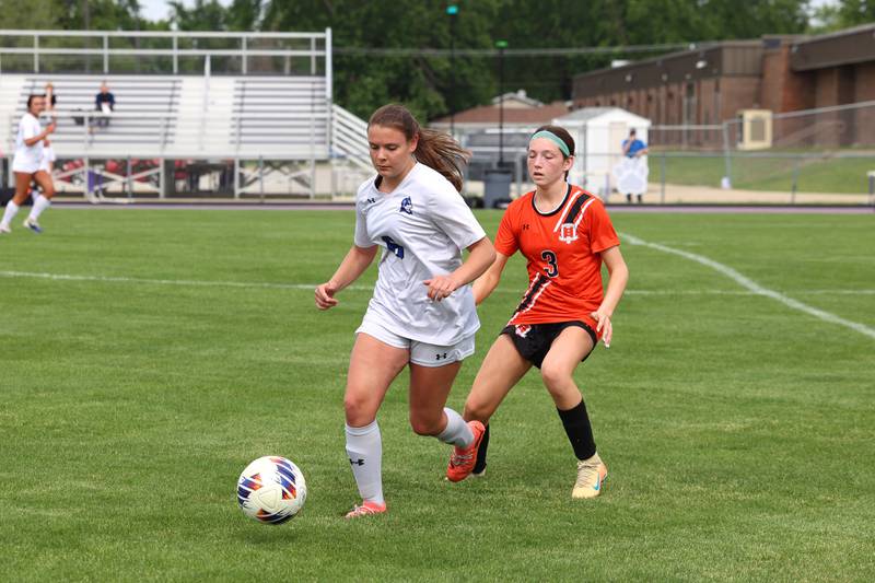 Peotone's Katelyn Leitelt dribbles away from Beecher's Molly Krupa during Peotone's 2-1 victory over Beecher in the Class 1A Manteno Regional championship on Friday, May 22, 2026.