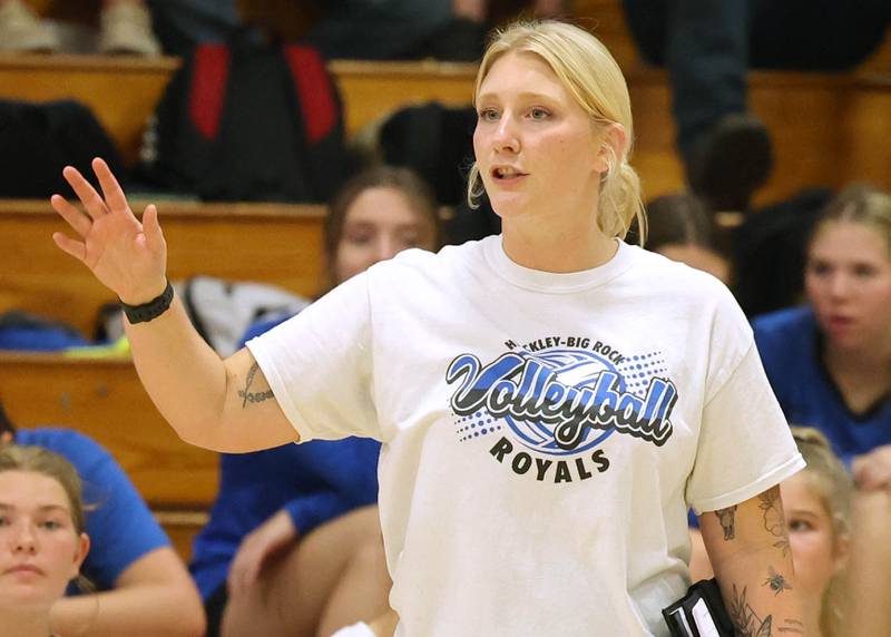 Hinckley-Big Rock head volleyball coach Jessica Bivens instructs her team during their match against Aurora Christian Tuesday night at the school in Hinckley.