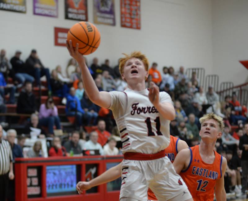 Forreston's Connor Politsch (11) drives to the basket against Eastland draws on Saturday, Jan. 4, 2025 at Forreston High School.