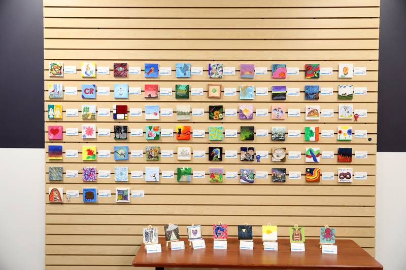 Art work done on small canvasses by early childhood students through adults is on display at the Westmont Public Library.