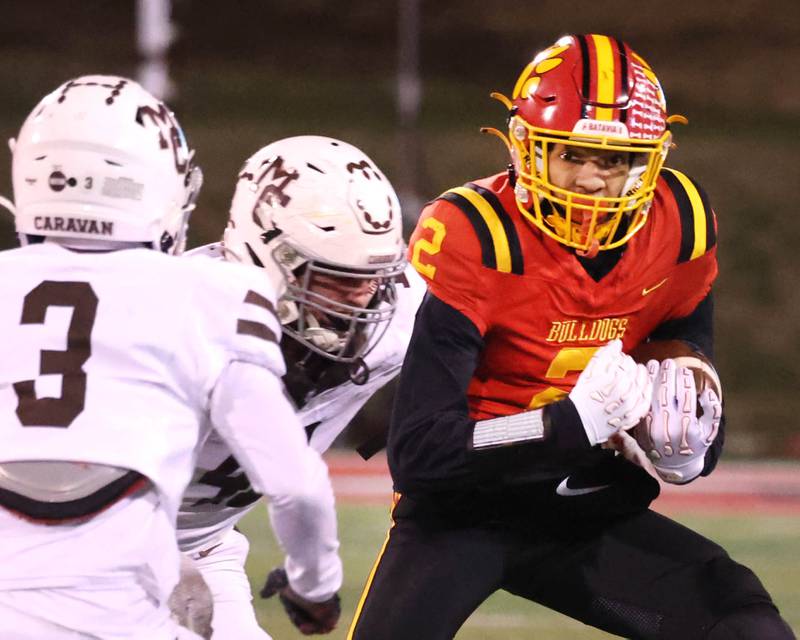 Batavia's Brennon Zeng tries to get by Mt. Carmel's Le’Javier Payne during their Class 8A state championship game Saturday, Nov. 30, 2024, in Hancock Stadium at Illinois State University in Normal.