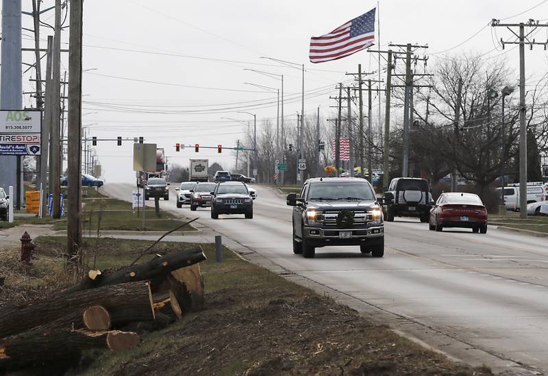 Logs are piled alongside Route 47 on Wednesday, Dec. 11, 2024, in Woodstock as tree removal continues in preparation for the Route 47 construction project.