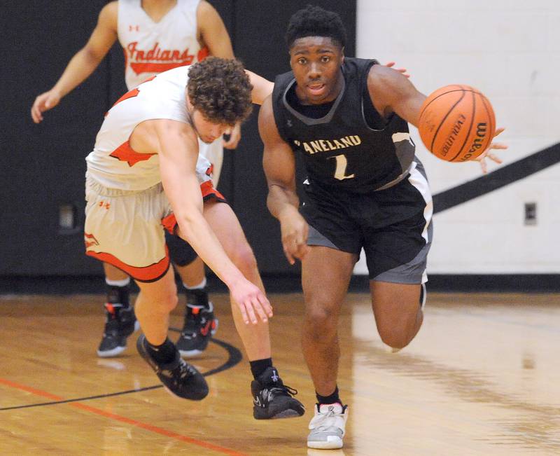 Kaneland's Gevon Grant (2) takes the ball away from Sandwich's Dylan Young during a boys' basketball game at Sandwich High School on Friday, Jan. 13, 2023.