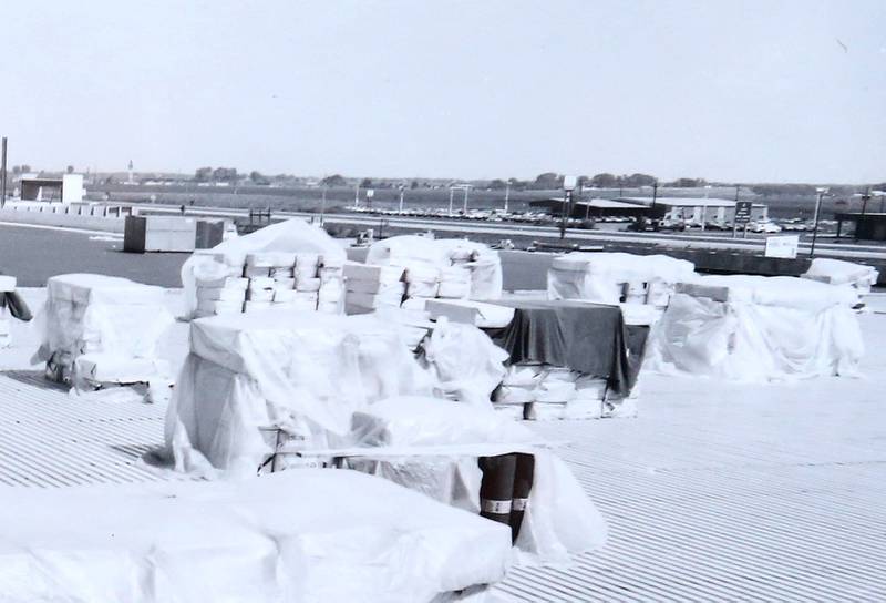 A rooftop view of shingles and other building materials needed to build the Peru Mall in 1974.