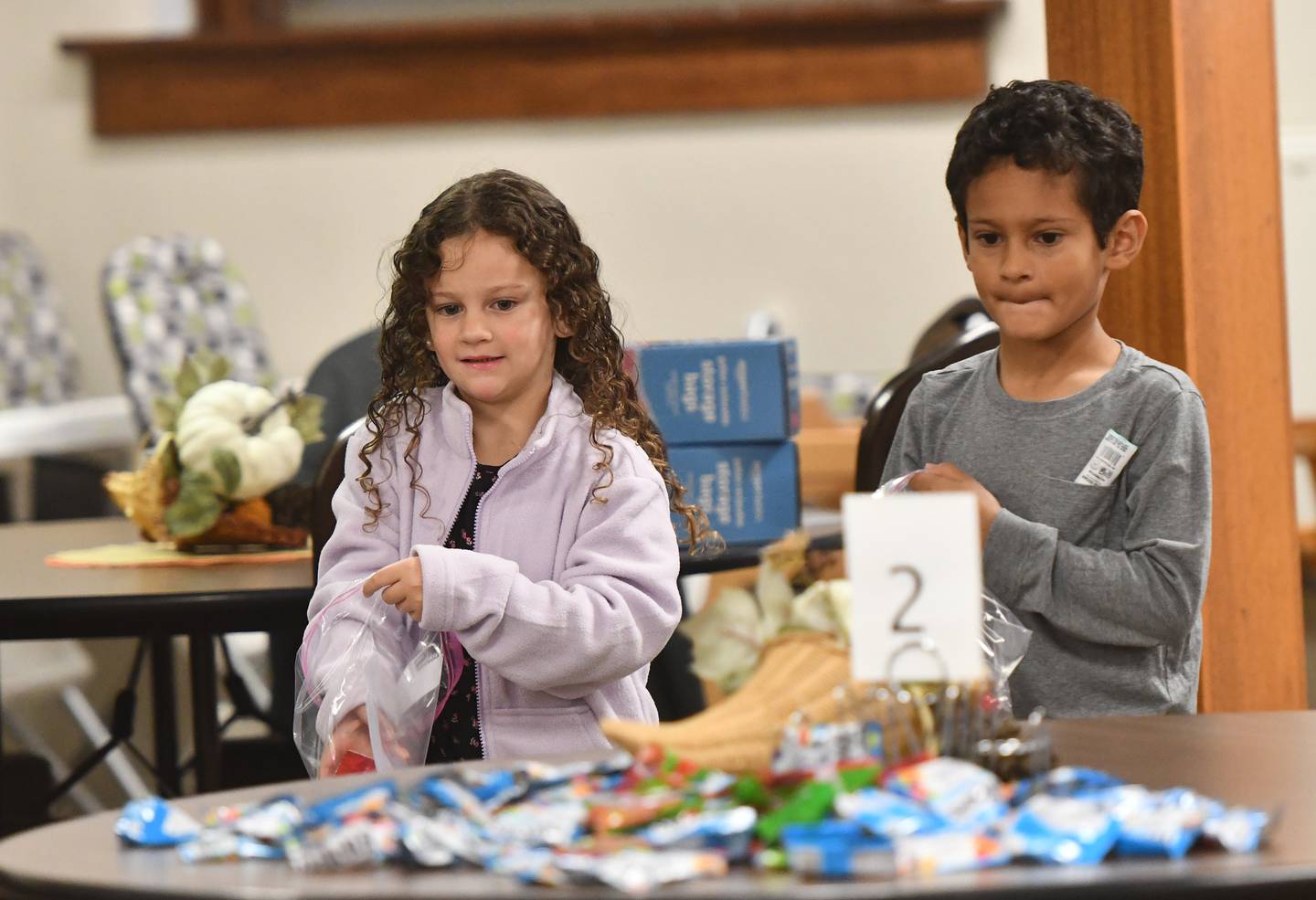 John and Eliana Murphy, ages 5 and 7, helped assemble care packages for sailors on the USS Fitzgerald at the Evangelical Free Church of Mt. Morris  on Thursday, Oct. 16, 2025. John and Elaine's dad is the chaplain on the destroyer.