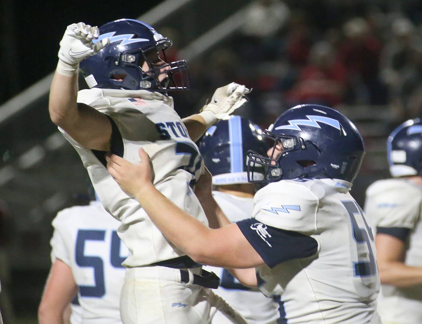 Bureau Valley's Cameron Lemons leaps in the air while being lifted up by teammate Jon Dybek after scoring a touchdown over Hall on Friday, Sept 8, 2023 at Richard Nesti Stadium.