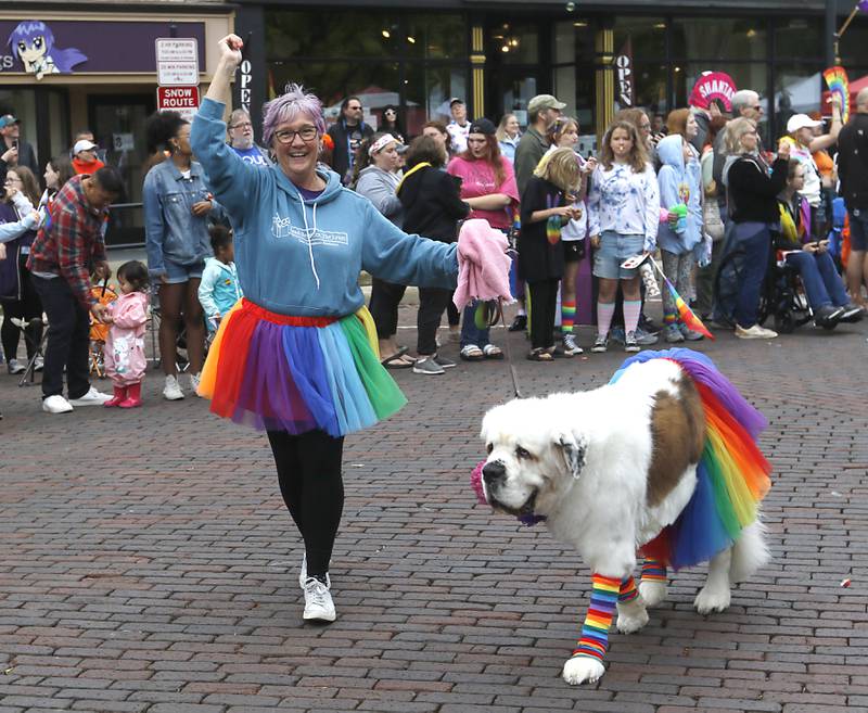 Arlene Lynes of Read Between The Lynes marches in the Woodstock PrideFest Parade Sunday, June 11, 2023, around the historic Woodstock Square.