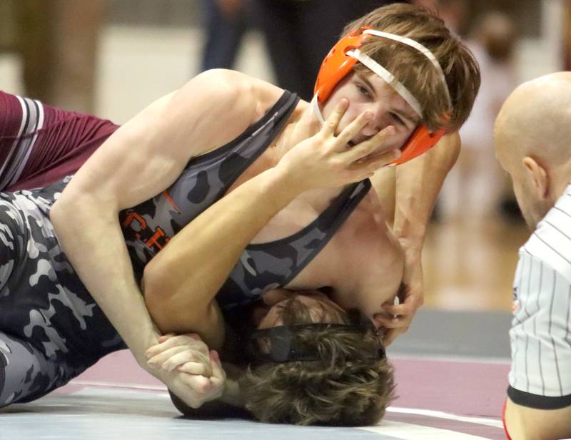 McHenry’s Ryan Johnston, top, battles Prairie Ridge’s Andrew Cioper at 150 pounds in varsity boys wrestling on Thursday, Jan. 8, 2026 at Prairie Ridge High School in Crystal Lake.