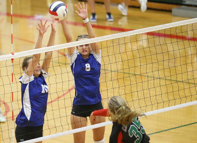 Princeton's Kathy Maciczak and teammate Keighley Davis block a kill from L-P's Aubrey Duttlinger on Tuesday, Aug. 22, 2023 in Sellett Gymnasium.