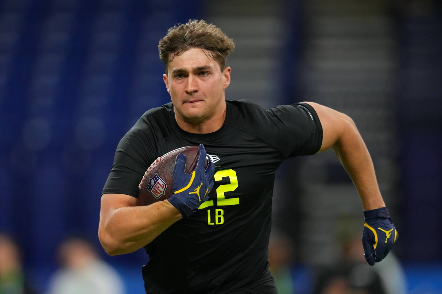 Michigan linebacker Jimmy Rolder (22) runs a drill at the NFL football scouting combine in Indianapolis, Thursday, Feb. 26, 2026. (AP Photo/Julio Cortez)