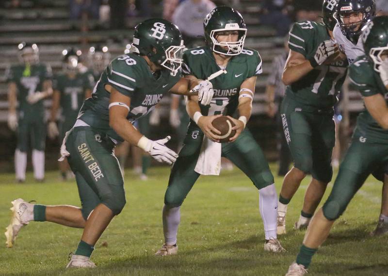 St. Bede quarterback Gino Ferrari hands the ball off to teammate Landon Marquez on Friday Aug. 29, 2025 at St. Bede Academy.