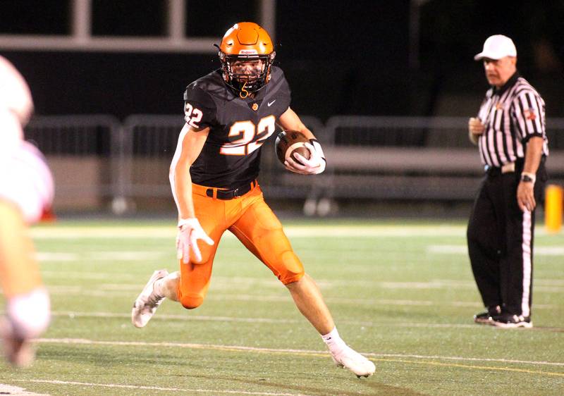 Wheaton Warrenville South’s Jake Vozza runs the ball during a home game against Geneva on Friday, Sept. 16, 2022.