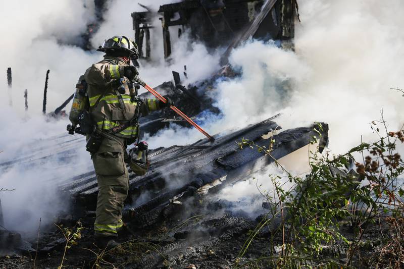 An abandoned two-story house was marked as a "total loss" on Saturday, Oct. 15, 2022 in rural Crystal Lake due to a fire.