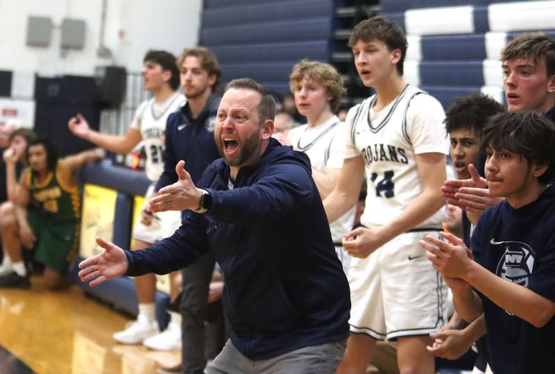 Cary-Grove’s Head Coach Adam McCloud guides the Trojans against Crystal Lake South in varsity boys basketball on Wednesday, Dec. 3, 2025, at Cary-Grove High School in Cary.