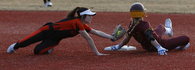 Crystal Lake Central's Gianna Carone tries to tag Richmond-Burton's Madison Kunzer as she slides into second base during a nonconference softball game Wednesday March 16, 2022, between Crystal Lake Central and Richmond-Burton at Lippold Park in Crystal Lake.