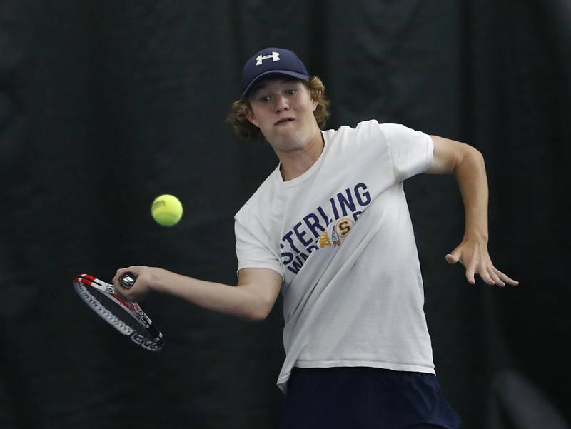 Sterling’s Brecken Peterson returns the ball during his IHSA 1A boys single tennis match against Lake’s Gavin Murrie Thursday, May 26, 2022, at Heritage Tennis Club in Arlington Heights.
