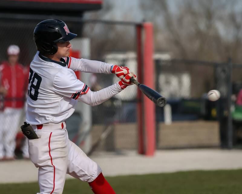 Hinsdale Central's Christo Malcolm (28) swings away during baseball game between Lyons at Hinsdale Central. April 19, 2022.