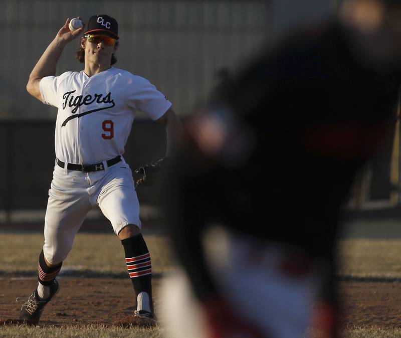 Crystal Lake Central’s Braydon Gibour throws to first to get the runner during a non-conference baseball game Tuesday, March 15, 2022, between Crystal Lake Central and Barrington at Barrington High School.