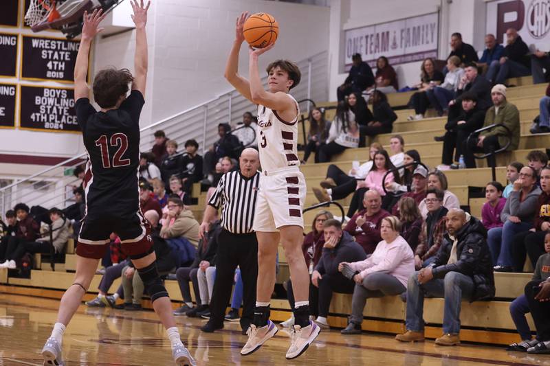 Lockport’s Trace Schaaf puts up the three point shot against Plainfield North on Friday, Jan. 3, 2025 in Lockport