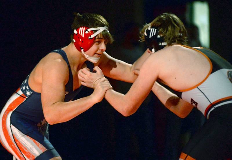 Morrison's Caleb Carroll (left) battles a Sandwich opponent in the 190-pound match at a triangular meet with Oregon on Friday, Jan. 31, 2025 in the Blackhawk Center at Oregon High School.
