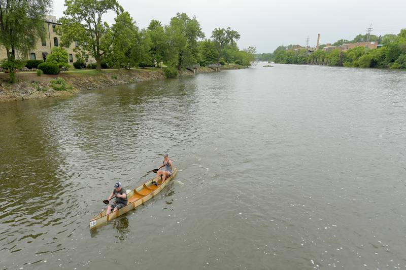 Canoeist paddle down the Fox River in Batavia during the annual Mid-American Canoe & Kayak Race on Saturday, June 1, 2024.
