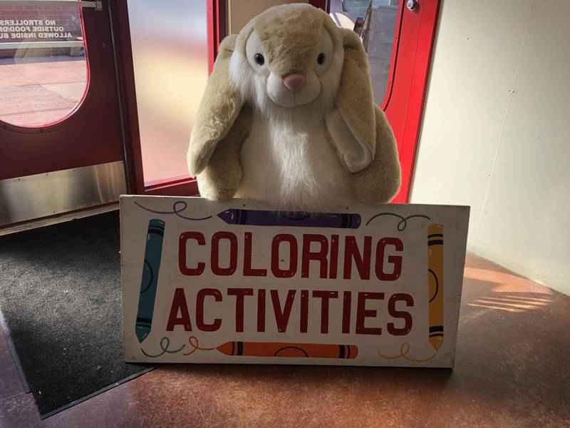 An Easter bunny with a "Coloring Activities" sign at the Illinois Railway Museum in Union March 23, 2024.