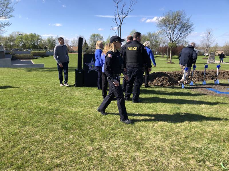 Lake in the Hills officials walk towards shovels a ceremonial groundbreaking at the new police station April 19, 2024.