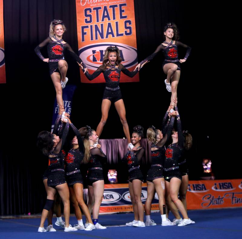 Members of the Crystal Lake Central cheerleading team compete in the medium team division of the IHSA State Finals on Saturday, Feb. 8, 2025 at Grossinger Motors Arena in Bloomington.
