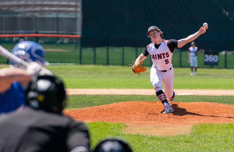 St. Charles East's Gavin Sitarz (5) delivers a pitch against St. Charles North during a baseball game at St. Charles East High School on Saturday, May 7, 2022.