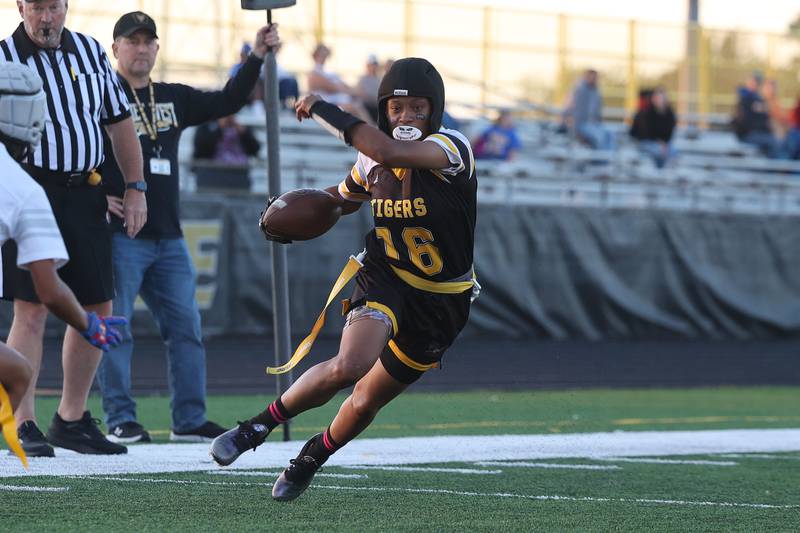 Joliet West’s Nevada Simms cuts upfield after a catch against Joliet Central on Wednesday, Oct. 2, 2024 in Joliet.