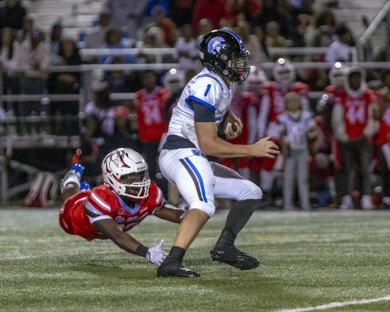 St. Francis's Brock Phillip (1) runs away from the defense during football game between St. Francis at Kenwood Academy on Thursday, Aug 28, 2025  in Chicago.
