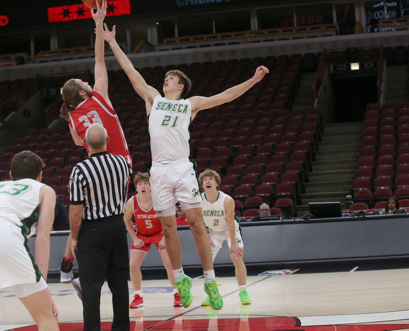 Streator's Quinn Baker wins the jump ball over Seneca's Lane Provance during a game on Tuesday, Dec. 21, 2023 at the United Center in Chicago.