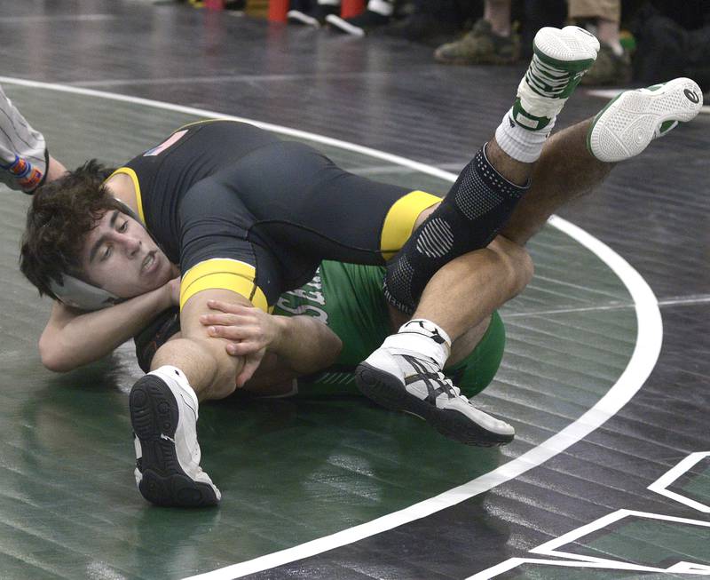 Seneca’s Ethan Othan looks to escape from the hold by Reed Custer’s Jayden Sanchez in the 132# match Wednesday at Seneca.