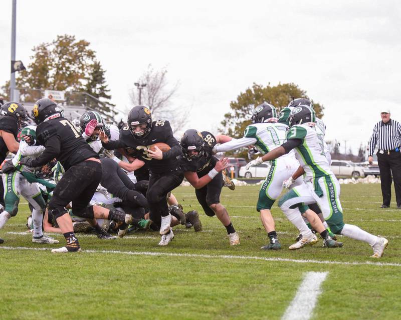 Sycamore Nathaniel Altepeter (35) runs the ball in for a touch down during the first quarter of the Nov. 2nd playoff game against Evergreen Park.