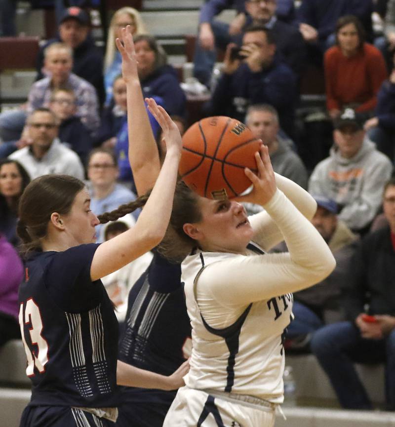 Cary-Grove's Emily Larry shoots the ball in front of St. Viator's Maeve McClellan during an IHSA Class 3A Antioch Sectional semifinal girls basketball game on Tuesday, Feb. 20, 2024, at Antioch High School.