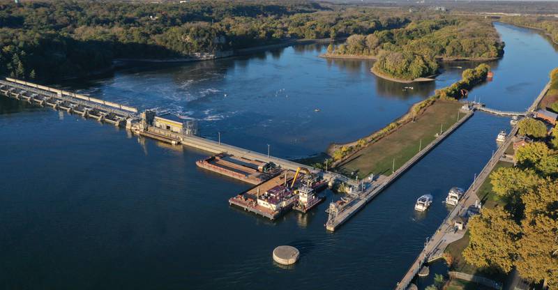 Trees begin to turn color on Thursday, Oct. 23, 2025 at the Starved Rock Lock and Dam. The fall colors have been late this season due to the dry drought conditions and warmer temperatures.