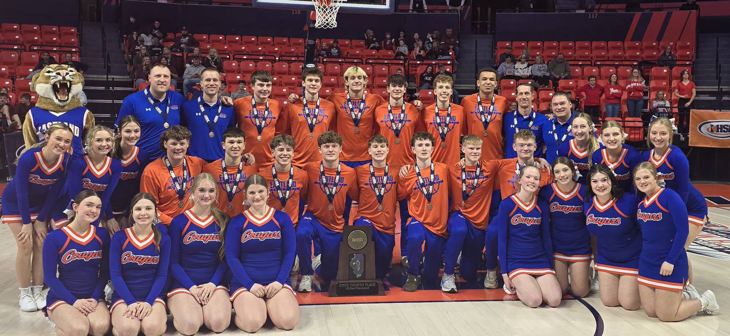Eastland's boys basketball team and cheerleaders are pictured after a fourth-place finish at state at State Farm Center in Champaign on Thursday, March 12, 2026.