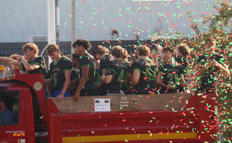 The L-P football team passes through confetti during the L-P homecoming parade on Thursday, Oct. 2, 2025 downtown La Salle.