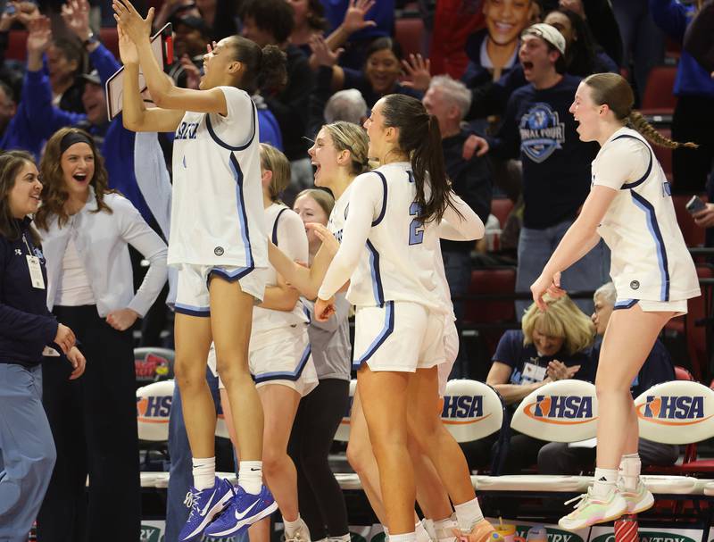 Members of the Nazareth girls basketball team react during the final seconds of the Class 4A State girls basketball championship game on Saturday, March 7, 2026 at CEFCU Arena in Normal.