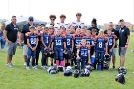 Leading by example: Oswego High School varsity football players support youth program