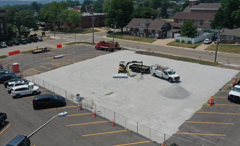 Crews from CAMCO Construction work on paving a lot at the corner of 7th and West Street on Monday, July 7, 2025 at OSF St. Elizabeth West Hospital in Peru.