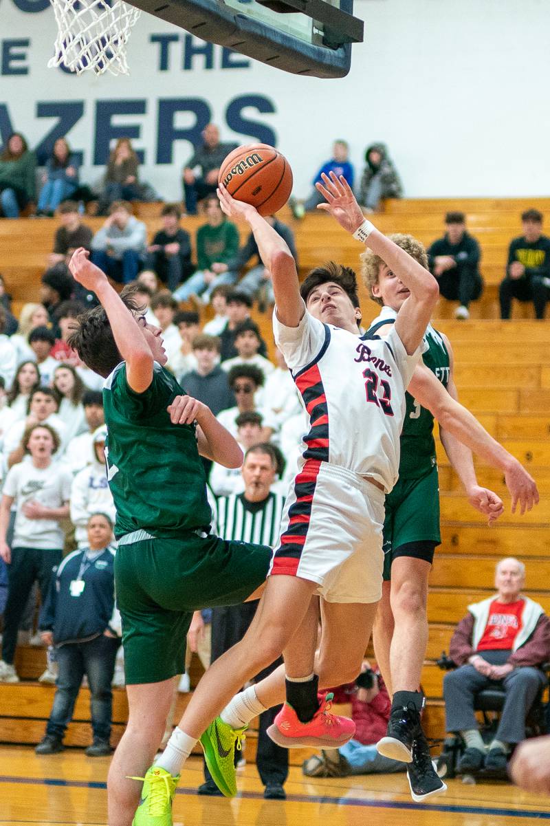 Benet’s Nikola Abusara (23) shoots the ball in the post against Bartlett's Kelton McEwen (left) and Bartlett's Nathan Scearce (right) during the 4A Addison Trail Regional final at Addison Trail High School in Addison on Friday, Feb 24, 2023.