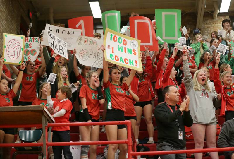 L-P superfans hold signs congratulating head volleyball coach Mark Haberkorn on his 1000th win on Tuesday, Oct. 18, 2022 at Kingman Gymnasium in Ottawa.