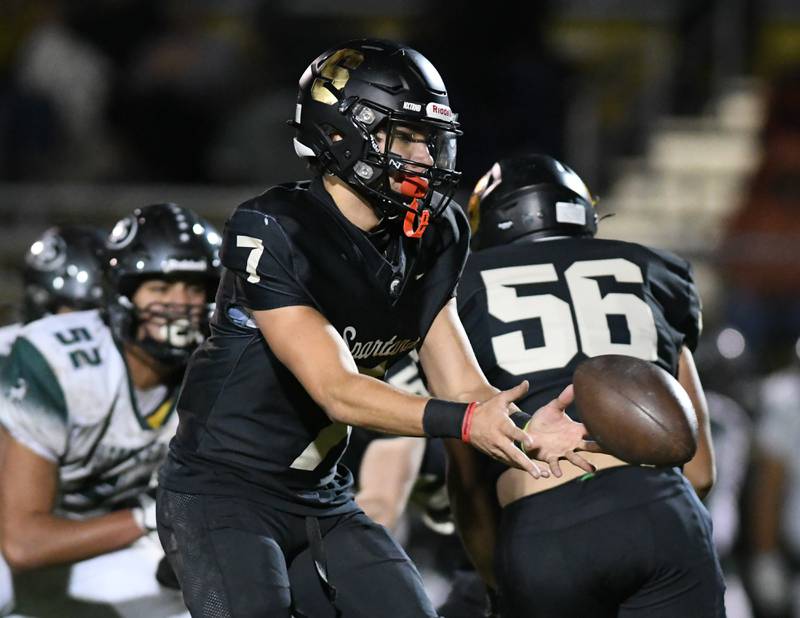 Sycamore Matthew Rangel (7) passes the ball to a teammate in the firth quarter on Friday Oct. 27, 2023, while taking on Evergreen Park during the first week of play offs held at Sycamore High School.