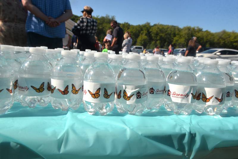 Bottles of water offered during Serenity Hospice & Home Memorial Butterfly Release on Saturday, July 8, 2023, in Oregon, featured butterflies on their labels.