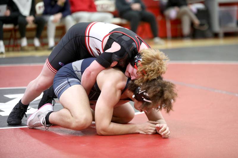 Yorkville’s Cameron Burke (top) battles Oswego East’s Charlie Anderson in the 190-pound weight class during a dual meet on Thursday, Jan. 9, 2025 in Yorkville.