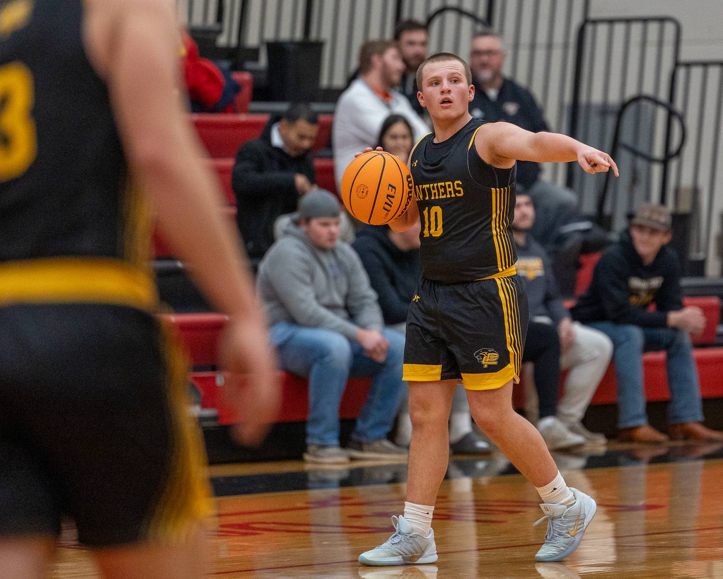 Traxton Mattingly (10) of Putnam County directs teammate in a play during the Colmone Classic on Monday, December 8, 2025 at Hall High School in Spring Valley.