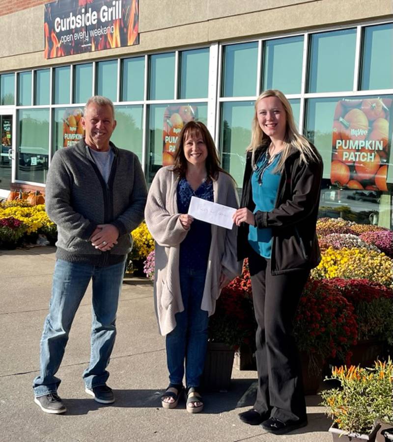 Hy-Vee Grocery store in Peru recently had an annual mums sale at the Peru location to benefit the local cops 4 cancer charity. They were able to raise $1320.00 which 100% of will be used to assist our local residents in their battles against cancer. Pictured from left are Cops 4 Cancer board member Bobby Thompson, Board President Betty Pappas and Hy-Vee manager Cherokee Gillispie.